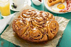 Sticky pecan buns on breakfast table photo