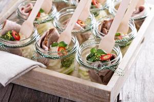 Roastbeef with mashed potatoes in small jars photo