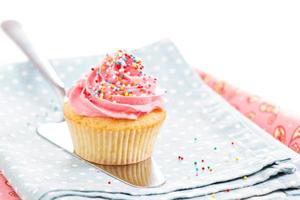 Cupcake with frosting and sprinkles photo