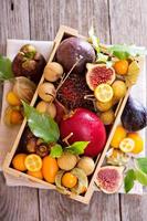 Exotic fruits in a wooden crate photo