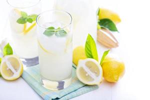 Freshly made lemonade in tall glasses photo