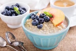 Breakfast quinoa porridge with fresh fruits photo