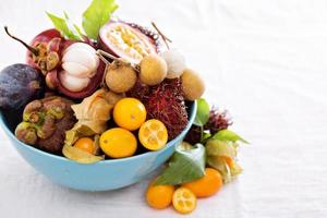 Exotic fruits on white background photo