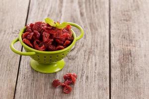 Dried cranberries in a green colander photo