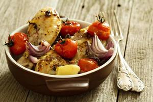 Roasted chicken with tomatoes and garlic photo