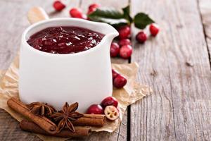 Cranberry sauce in ceramic saucepan photo