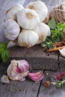 Garlic heads on a wooden table photo