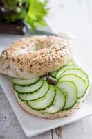 Everything bagels with cream cheese and cucumber photo