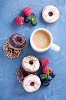 Small mini donuts with fresh berries photo