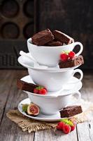 Brownies in stacked coffee cups with chocolate sauce photo