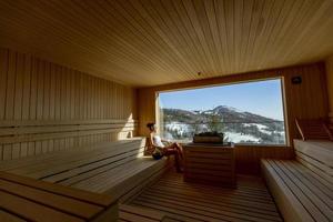 Young woman relaxing in the sauna photo