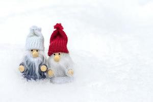 Christmas holiday card Cute scandinavian gnomes with red, white hat and beard in snowy winter forest Fairytale snowfall Wintertime Hello December, January, February concept Happy New Year, Christmas photo