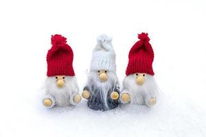 Christmas holiday card Cute scandinavian gnomes with red, white hat and beard in snowy winter forest Fairytale snowfall Wintertime Hello December, January, February concept Happy New Year, Christmas photo