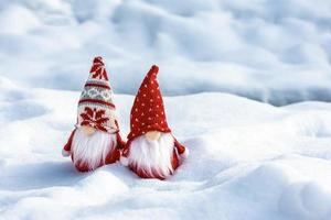 Christmas holiday card Cute scandinavian gnomes with red hat and white beard on snowy winter forest Fairytale snowfall Wintertime Hello December, January, February concept Happy New Year, Christmas photo