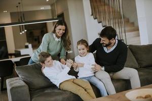 Siblings fighting over TV remote control at home photo