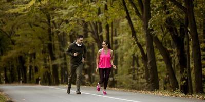 Young people jogging and exercising in nature photo