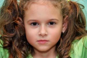 Potrait of curly hair little girl photo