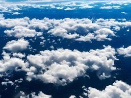 view of the clouds from an airplane window. Generative AI. photo