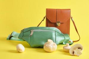 brown and green eco leather bags and champignons , vegan leather from mushroom mycelium concept photo