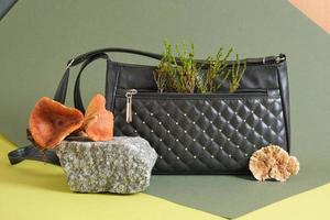 black shoulder bag made of eco leather made from mushroom mycelium, vegan mushroom leather concept photo