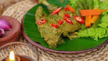 duck food with green chili complete with spices photo