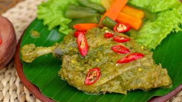 duck food with green chili complete with spices photo