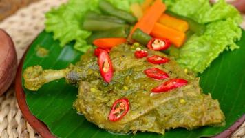 duck food with green chili complete with spices photo