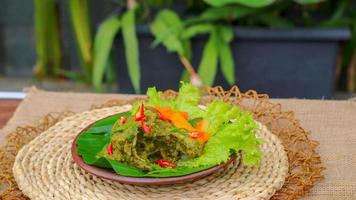 duck food with green chili complete with spices photo