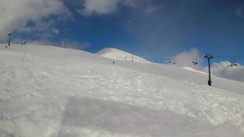 Timelapse skiers downhill in high caucasus mountains. Eurasia. Europe video