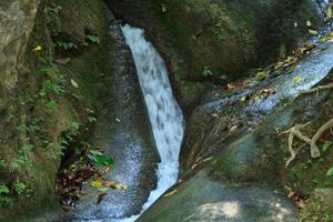 Erawan Waterfall is a beautiful nature. Foreigners come to visit from many countries. It is a rich nature on the high mountains in Thailand. photo