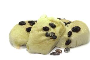 Butter bread with raisins straight from the oven on a white background. photo