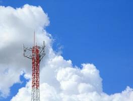 Tall telephone poles are ready to distribute Internet and telephone signals for the public to make full use of them against the background of the beautiful natural afternoon white and blue sky. photo