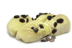 Butter bread with raisins straight from the oven on a white background. photo