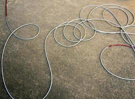 New wire rope cable on concrete floor photo