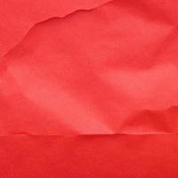 Red crumpled background paper texture. High quality background and copy space for text. photo