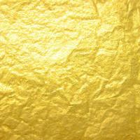 Gold crumpled background paper texture. High quality background and copy space for text. photo