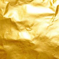 Gold crumpled background paper texture. High quality background and copy space for text. photo