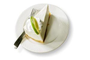 Top view Thai style lime cream cake on white ceramic plate and isolated on white background. photo