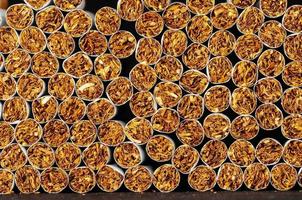 Tobacco Industry Concept with stacked cigarettes photo