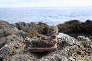 Pre-columbian miniature on the rocks photo