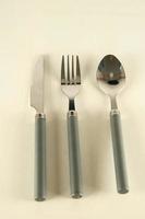 Metal cutlery on light background photo