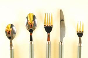 Metal cutlery on light background photo