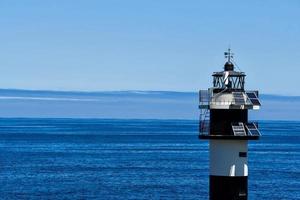 Lighthouse by the sea photo