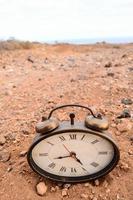 Classic Analog Clock In The Sand photo