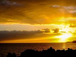 Sunset over the ocean photo