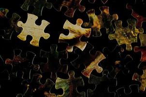 Puzzle pieces on the table photo