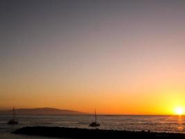 Sunset over the ocean photo