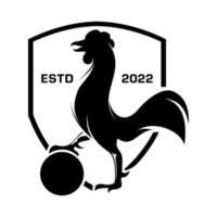 The dashing black and white rooster stands upright with his right leg while gripping the ball vector