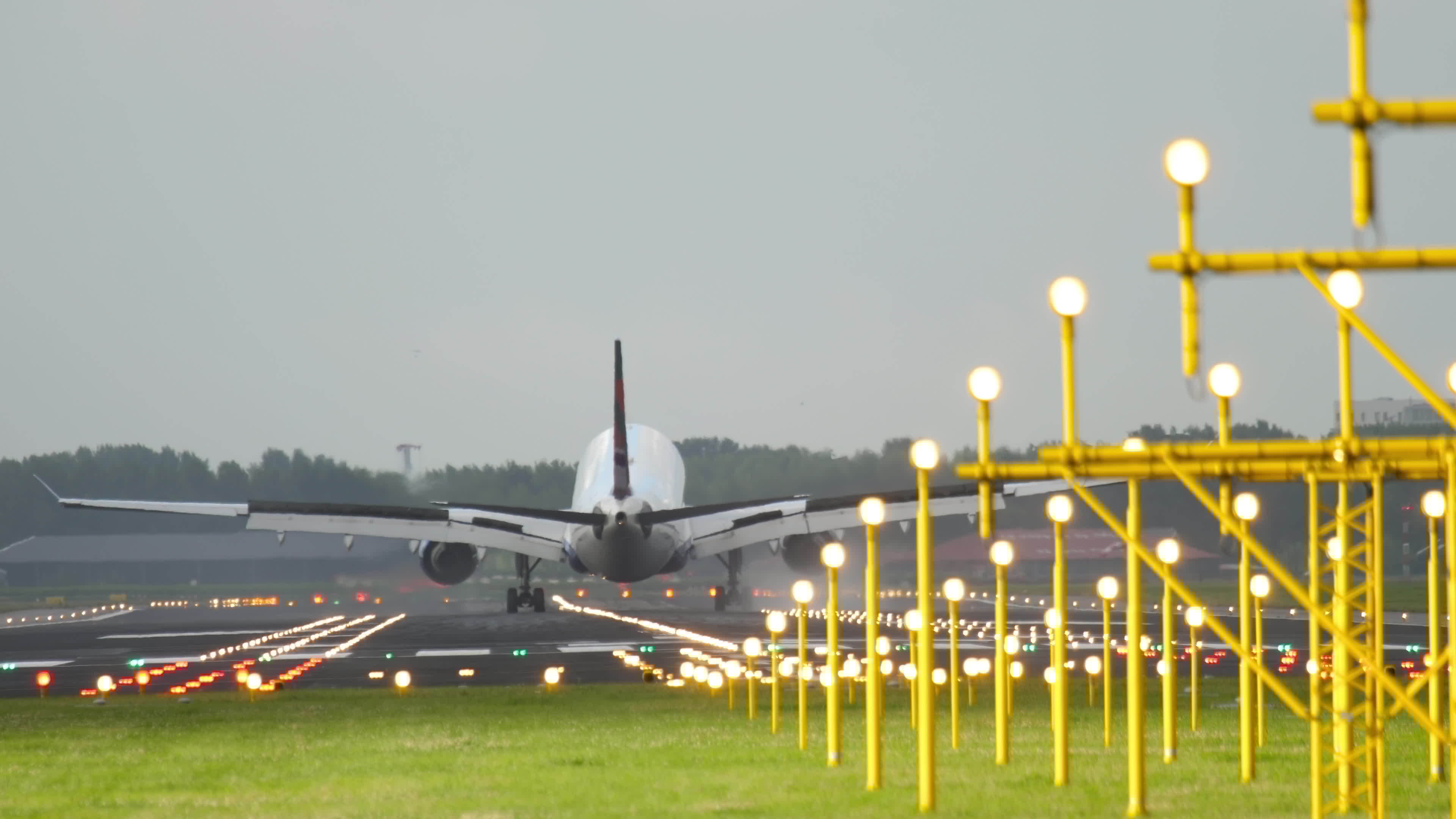Airplane arrival at the airport, brake on the runway. Cinematic shot of