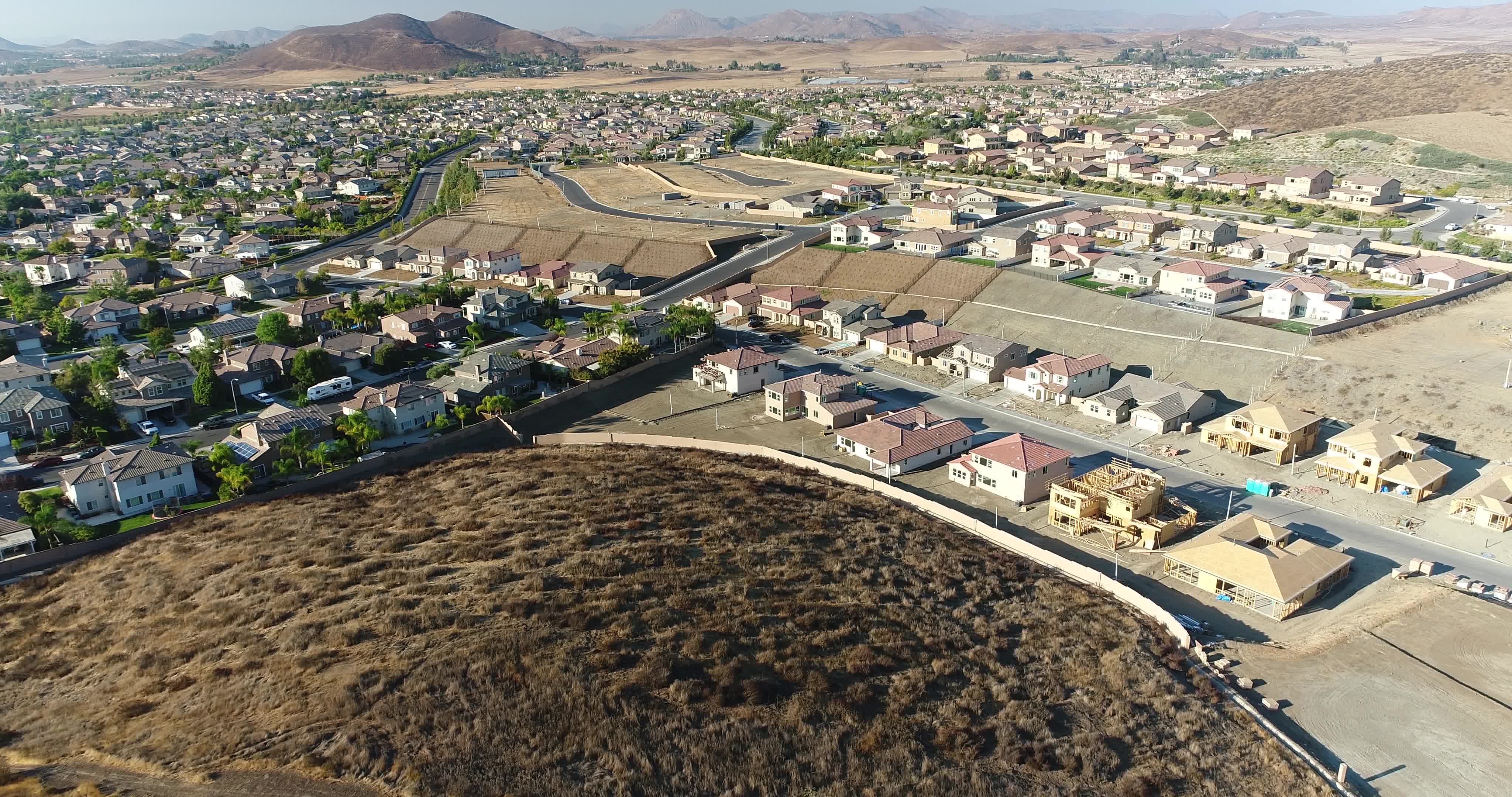 High Definition 4k Pan Up Over New and Developed Home Construction